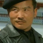 Miao Tian as the sniper who shoots Lo Dik