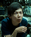Pang Tao's gun shop worker