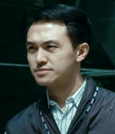 cop arresting Mr Ko