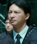 cop arresting Mr Ko