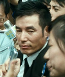 Ken's escort outside court