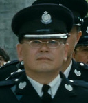 Police Officer at Billy's funeral ceremony