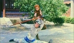 foreground: Wai An's younger brother Nai Cha in disguise<BR>
background: the Monkey King
