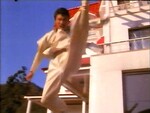 Yoo Chang-guk performing a jumping spinning axe kick.