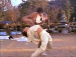 Yoo Chang-guk using his flexibility to dodge attack.