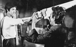 A still of the most famous deleted scene in a martial arts movie ever!<br> (According to Steve Kerridge and Darren Chua in their book "Bruce Lee: Mandarin Superstar", this scene was only shown at the initial screening of the THE BIG BOSS,
on October 17th 1971, which was for cinema owners and prospective buyers only.)
