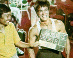 behind the scenes of THE WAY OF THE DRAGON: <br>
Director Alex Cheung did work on the film back then. His exact role is not known,
but being asked by Toby Russell, he replied that he wrote the words on the clapper board – thus being an assistant cameraman.