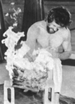 footage of a real life demonstration <br> with Bob Wall breaking bricks set on fire
as shown on 16 mm to Bruce Lee in the movie