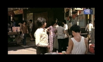 screenshot from THE SYSTEM; <br>
in the background Chang Cheh's THE DAREDEVILS (1979) is announced in the streets of Hong Kong