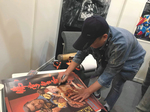 Hong Kong Film Market / 18th â€“ 21st March 2019:<br>
Mang Hoi paying Toby Russell, Hong Kong and Taiwan movie expert and owner of all IFD rights, a visit in his booth and signing the original poster for THE BUDDHA ASSASSINATOR. â€“ Many actors, actresses or producers come around to such events.
