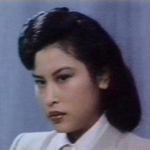 Lau Lai-Gwan as She Woy Jeng, alias Mrs. Ng Si Bo