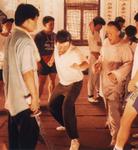 Behind the scenes photo, Tsui Hark coaches a stuntman